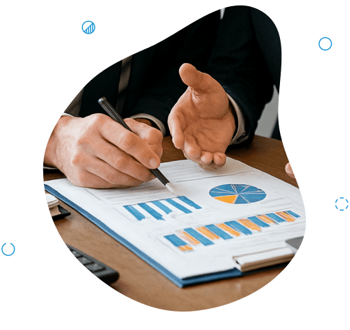 Two people discussing financial charts and graphs on a clipboard - bookkeeping