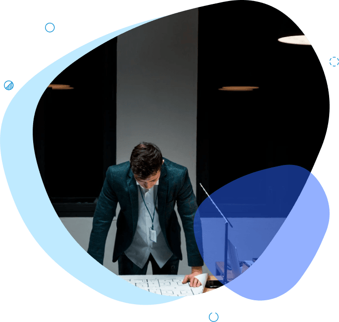 Business professional analyzing documents under focused lighting, representing due diligence and strategic planning- due diligence